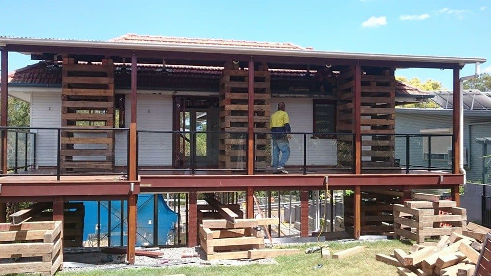 Professional inspecting a raised house in Brisbane