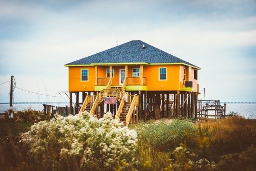 Orange house on stilts